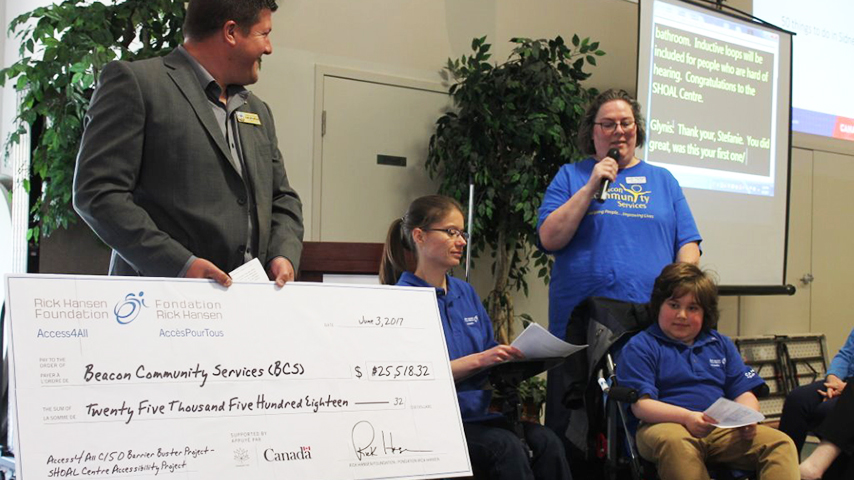 SHOAL Centre team members shows the grant cheque